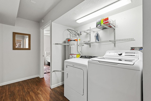 1575 Fig Ave, Redding, CA 96001 - laundry room with washing machine and clothes dryer, water heater, and dark wood-style flooring