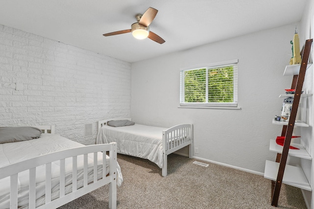 1575 Fig Ave, Redding, CA 96001 - carpeted bedroom with ceiling fan and brick wall