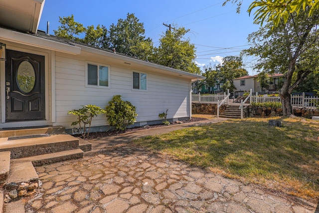 1575 Fig Ave, Redding, CA 96001 - view of exterior entry with a yard and a wooden deck