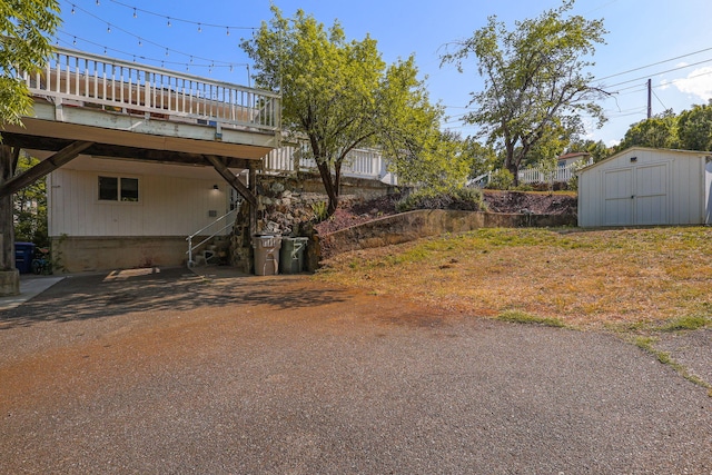 1575 Fig Ave, Redding, CA 96001 - view of yard with a wooden deck, a storage unit, and stairway