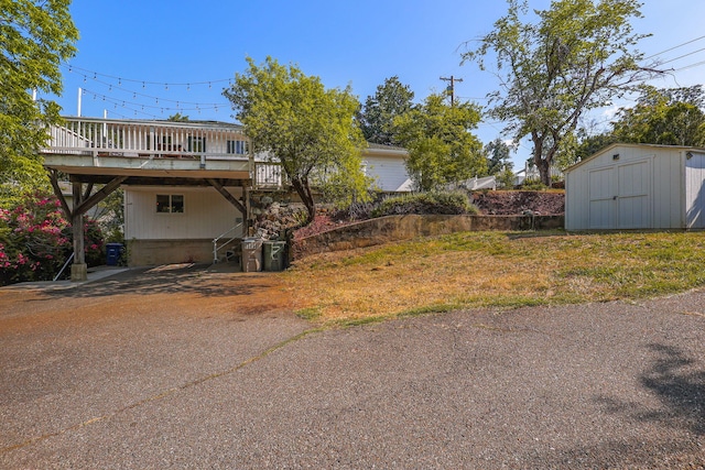 1575 Fig Ave, Redding, CA 96001 - view of property exterior with a deck and a storage unit