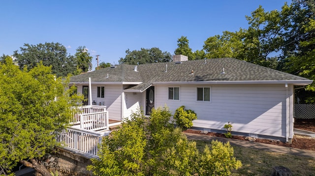 1575 Fig Ave, Redding, CA 96001 - back of house featuring a chimney and a shingled roof