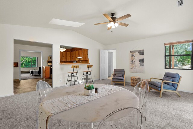 3639 E Keswick Dam Rd, Redding, CA 96003 - dining room featuring light carpet, lofted ceiling, ceiling fan, and plenty of natural light