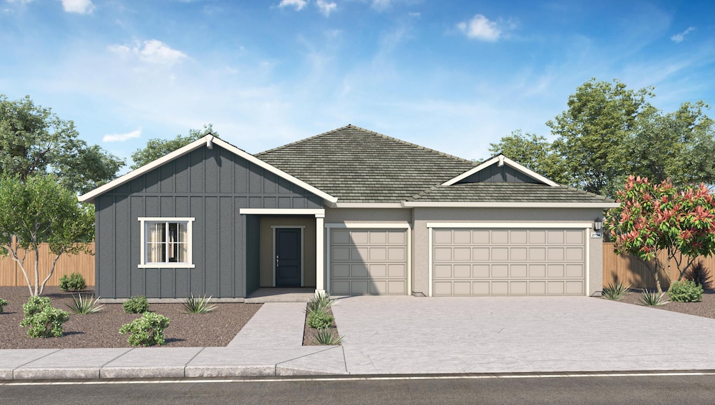 5456 Petal Pl, Redding, CA 96002 - view of front of house featuring an attached garage, driveway, and board and batten siding