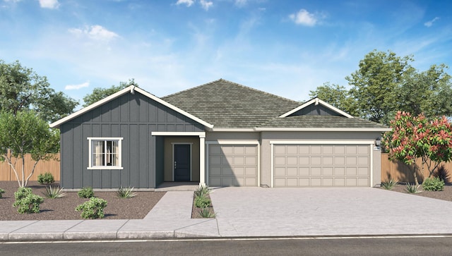5456 Petal Pl, Redding, CA 96002 - view of front of house featuring an attached garage, driveway, and board and batten siding