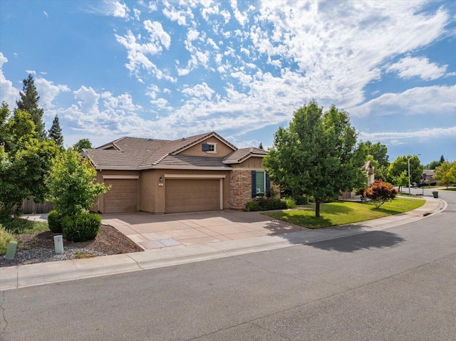 691 Rivercrest Pkwy, Redding, CA 96002 - view of front of house featuring a tile roof, concrete driveway, stone siding, stucco siding, and a garage