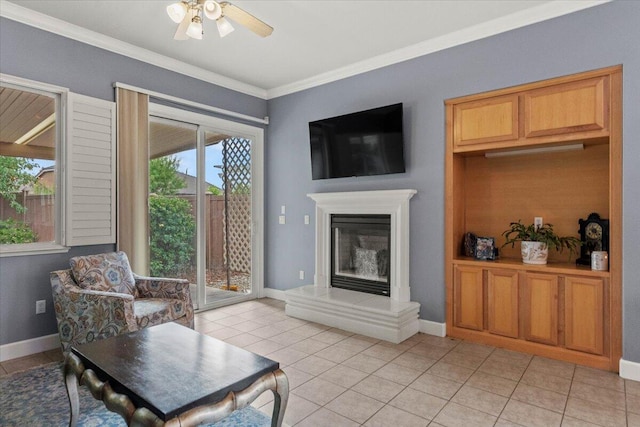 691 Rivercrest Pkwy, Redding, CA 96002 - living area featuring a ceiling fan, ornamental molding, light tile patterned floors, and a glass covered fireplace