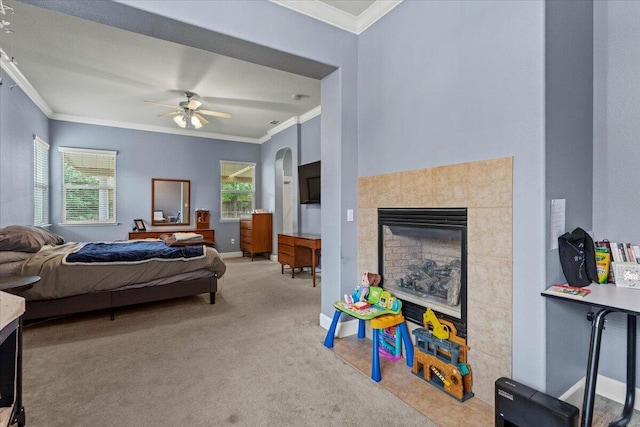 691 Rivercrest Pkwy, Redding, CA 96002 - carpeted bedroom with ornamental molding, a tiled fireplace, and ceiling fan