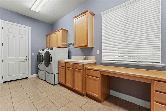 691 Rivercrest Pkwy, Redding, CA 96002 - laundry room with washer and clothes dryer, cabinet space, an office area, and light tile patterned flooring