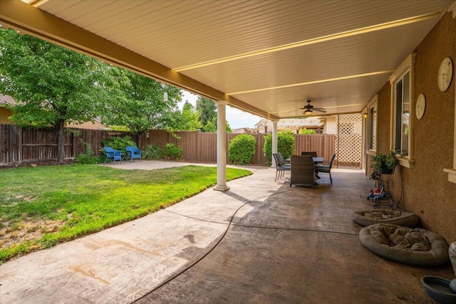 691 Rivercrest Pkwy, Redding, CA 96002 - fenced backyard with a patio, outdoor dining space, and ceiling fan
