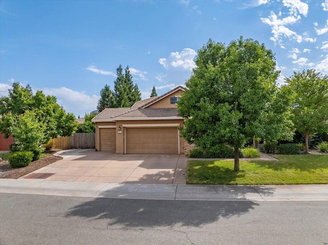 691 Rivercrest Pkwy, Redding, CA 96002 - view of property hidden behind natural elements with driveway, a garage, a tiled roof, and stucco siding