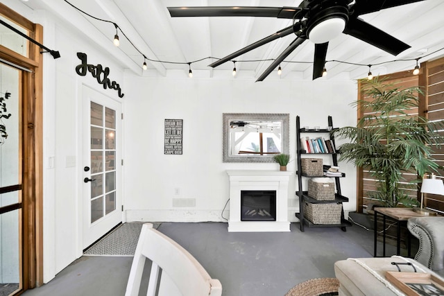 3075 Forest Hills Dr, Redding, CA 96002 - living area featuring finished concrete floors, ceiling fan, and a glass covered fireplace