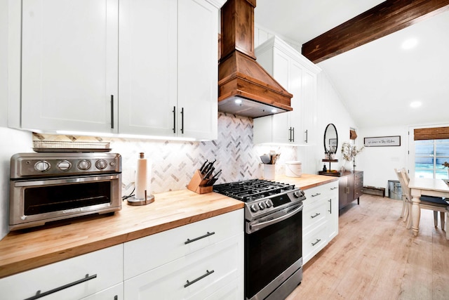 3075 Forest Hills Dr, Redding, CA 96002 - kitchen featuring butcher block countertops, gas range, premium range hood, tasteful backsplash, and light wood finished floors
