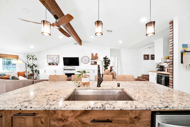3075 Forest Hills Dr, Redding, CA 96002 - kitchen with open floor plan, beverage cooler, pendant lighting, brown cabinetry, and recessed lighting