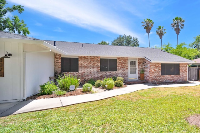 3075 Forest Hills Dr, Redding, CA 96002 - ranch-style home featuring a front lawn, brick siding, and a shingled roof