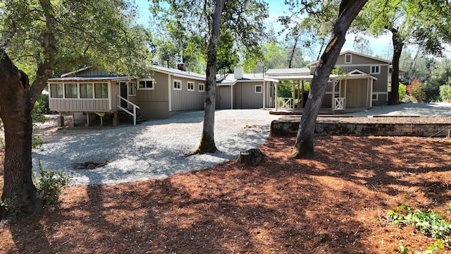 12194 Lake Blvd, Redding, CA 96001 - rear view of house with a sunroom and a patio