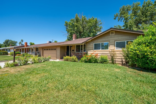 2076 Merle Dr, Redding, CA 96001 - ranch-style house with an attached garage, a chimney, and a front lawn