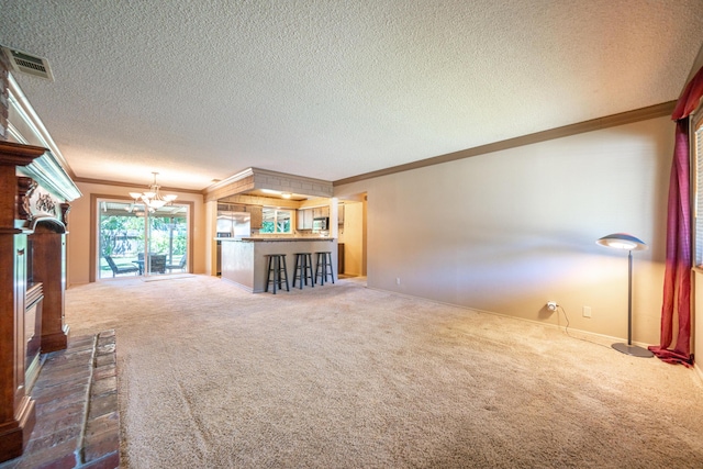 2076 Merle Dr, Redding, CA 96001 - unfurnished living room with dark carpet, ornamental molding, a chandelier, a textured ceiling, and a fireplace