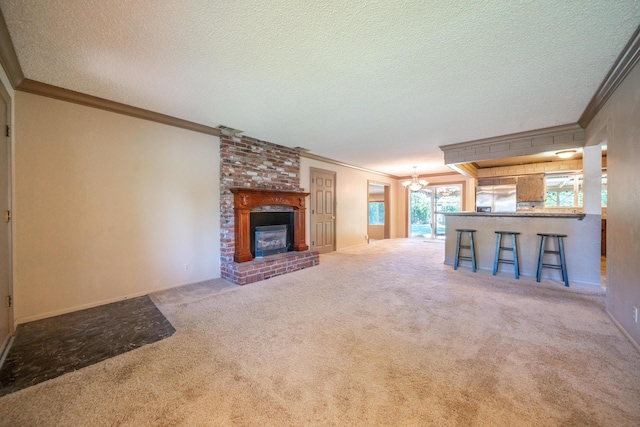 2076 Merle Dr, Redding, CA 96001 - unfurnished living room featuring ornamental molding, carpet, a chandelier, a fireplace, and a textured ceiling