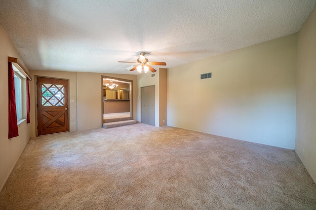 2076 Merle Dr, Redding, CA 96001 - unfurnished living room featuring a chandelier, carpet floors, a textured ceiling, and ceiling fan