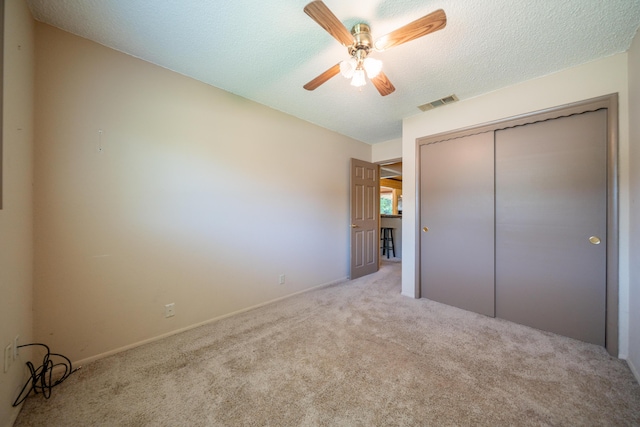 2076 Merle Dr, Redding, CA 96001 - unfurnished bedroom with carpet, a closet, a ceiling fan, and a textured ceiling