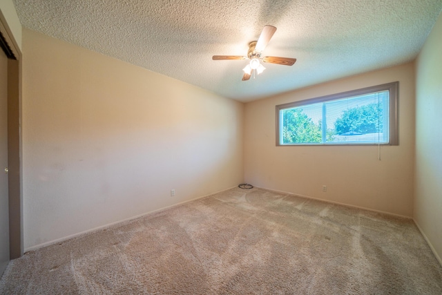 2076 Merle Dr, Redding, CA 96001 - carpeted empty room with a ceiling fan and a textured ceiling
