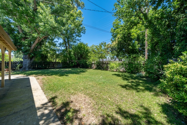 2076 Merle Dr, Redding, CA 96001 - fenced backyard featuring a patio