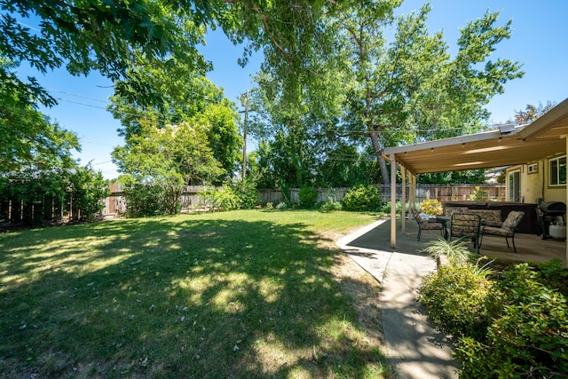2076 Merle Dr, Redding, CA 96001 - fenced backyard featuring a patio
