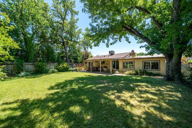 2076 Merle Dr, Redding, CA 96001 - fenced backyard featuring a patio