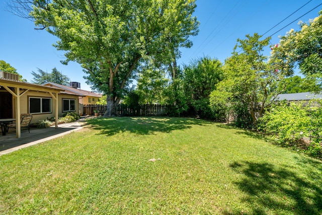 2076 Merle Dr, Redding, CA 96001 - fenced backyard with a patio