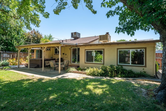 2076 Merle Dr, Redding, CA 96001 - rear view of property featuring a patio area, stucco siding, a chimney, and an outdoor hangout area