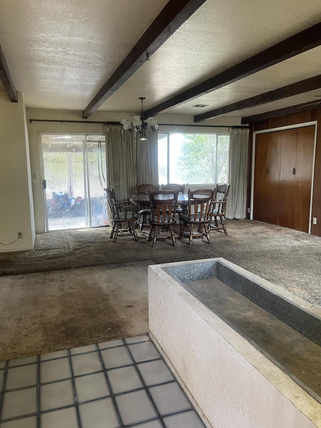 1110 Dusty Ln, Redding, CA 96002 - dining area with beam ceiling, a chandelier, and a textured ceiling