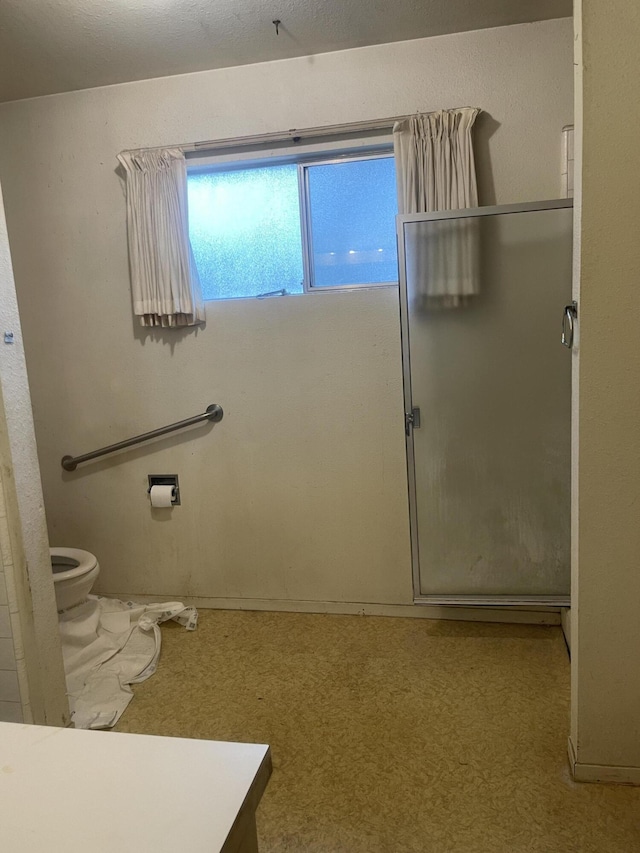 1110 Dusty Ln, Redding, CA 96002 - bathroom with toilet and a shower with door