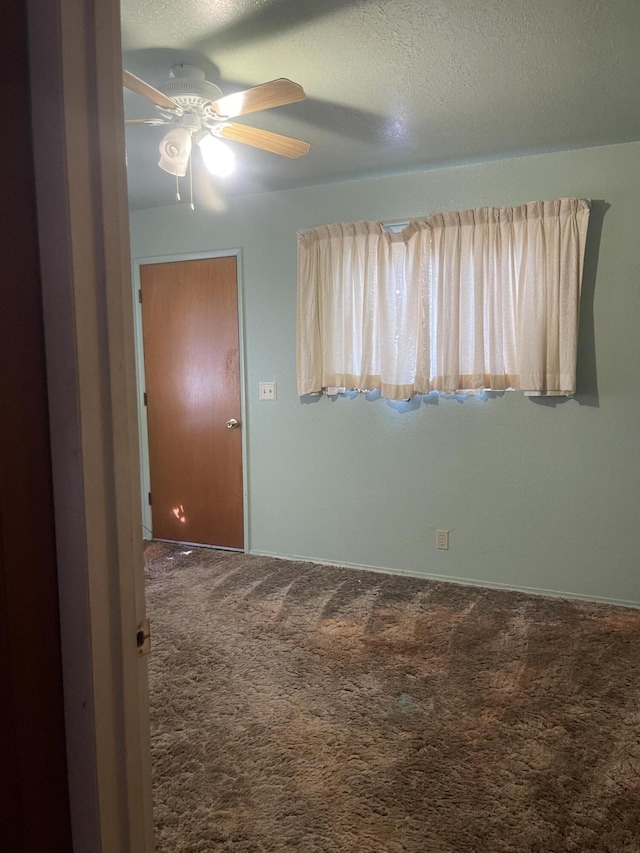 1110 Dusty Ln, Redding, CA 96002 - carpeted spare room featuring a ceiling fan and a textured ceiling