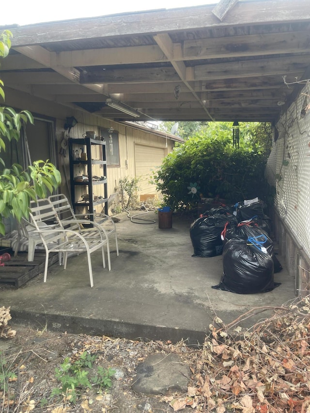 1110 Dusty Ln, Redding, CA 96002 - view of patio / terrace featuring a carport and electric panel