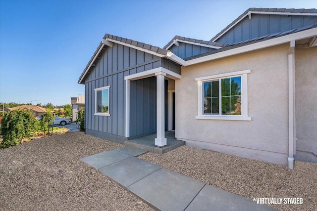 876 Wind Cove Dr, Redding, CA 96001 - property entrance featuring board and batten siding