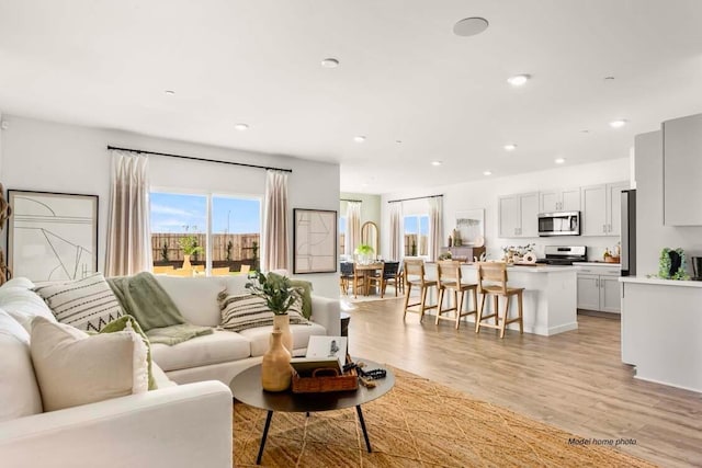 876 Wind Cove Dr, Redding, CA 96001 - living room featuring light wood-type flooring and recessed lighting