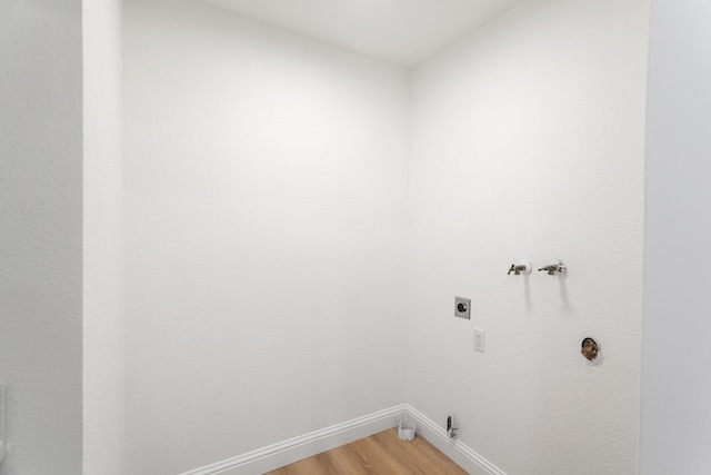 2445 Toyon St, Anderson, CA 96007 - laundry room with hookup for an electric dryer, hookup for a washing machine, light wood-style flooring, and gas dryer hookup