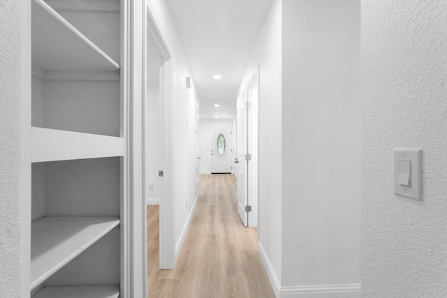 2445 Toyon St, Anderson, CA 96007 - hallway with wood finished floors, recessed lighting, and a textured wall