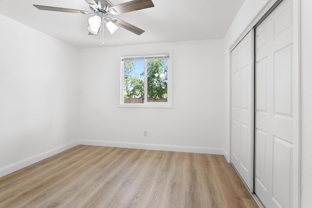 2445 Toyon St, Anderson, CA 96007 - unfurnished bedroom featuring a closet, light wood-style floors, and a ceiling fan