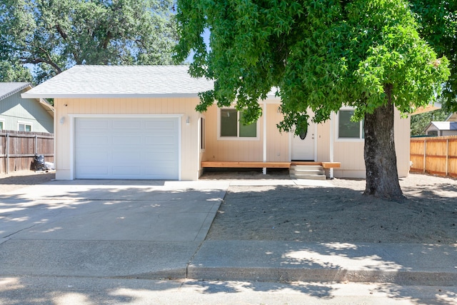 2445 Toyon St, Anderson, CA 96007 - view of front of property with an attached garage, driveway, and a shingled roof