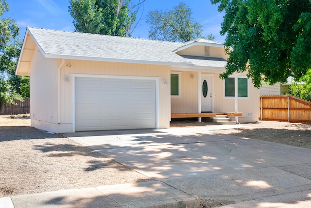 2445 Toyon St, Anderson, CA 96007 - view of front of house featuring a shingled roof, a garage, and concrete driveway