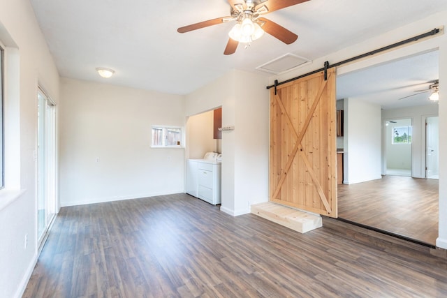 1535 Provo Ave, Shasta Lake, CA 96019 - unfurnished living room with independent washer and dryer, a barn door, ceiling fan, and wood finished floors