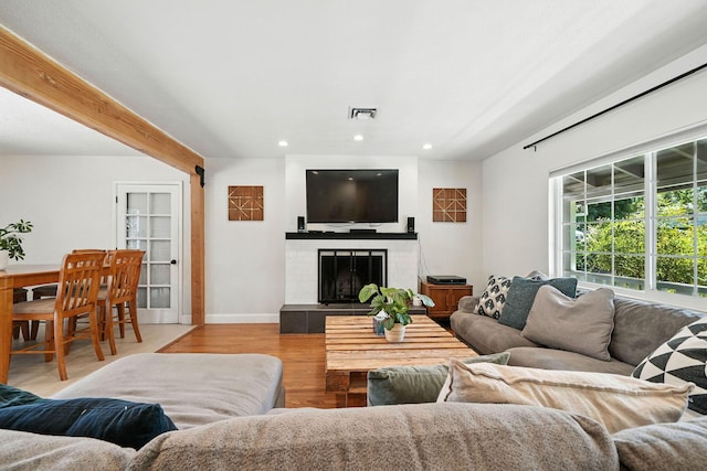 1448 Carter Way, Redding, CA 96002 - living room with recessed lighting, wood finished floors, and a fireplace