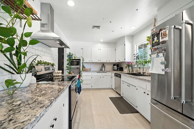 1448 Carter Way, Redding, CA 96002 - kitchen with stainless steel appliances, extractor fan, decorative backsplash, white cabinets, and recessed lighting
