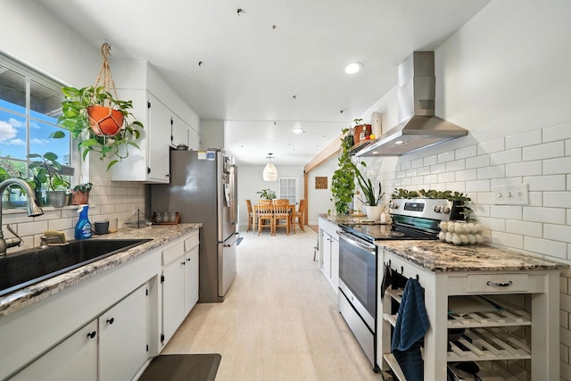 1448 Carter Way, Redding, CA 96002 - kitchen with stainless steel appliances, wall chimney range hood, white cabinets, decorative backsplash, and recessed lighting