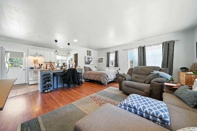 1448 Carter Way, Redding, CA 96002 - living room featuring light wood-type flooring and recessed lighting