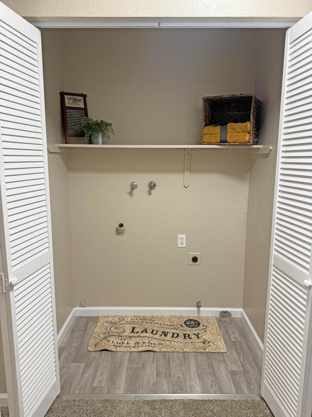 2855 Red Bud Ln, Anderson, CA 96007 - washroom with hookup for an electric dryer and wood finished floors