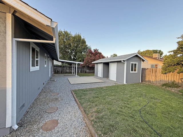 2855 Red Bud Ln, Anderson, CA 96007 - fenced backyard with a patio and an outdoor structure