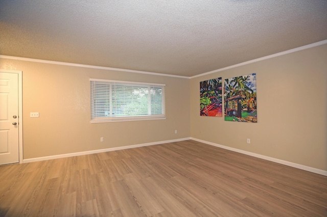 2855 Red Bud Ln, Anderson, CA 96007 - unfurnished room with a textured ceiling, light wood-type flooring, and crown molding